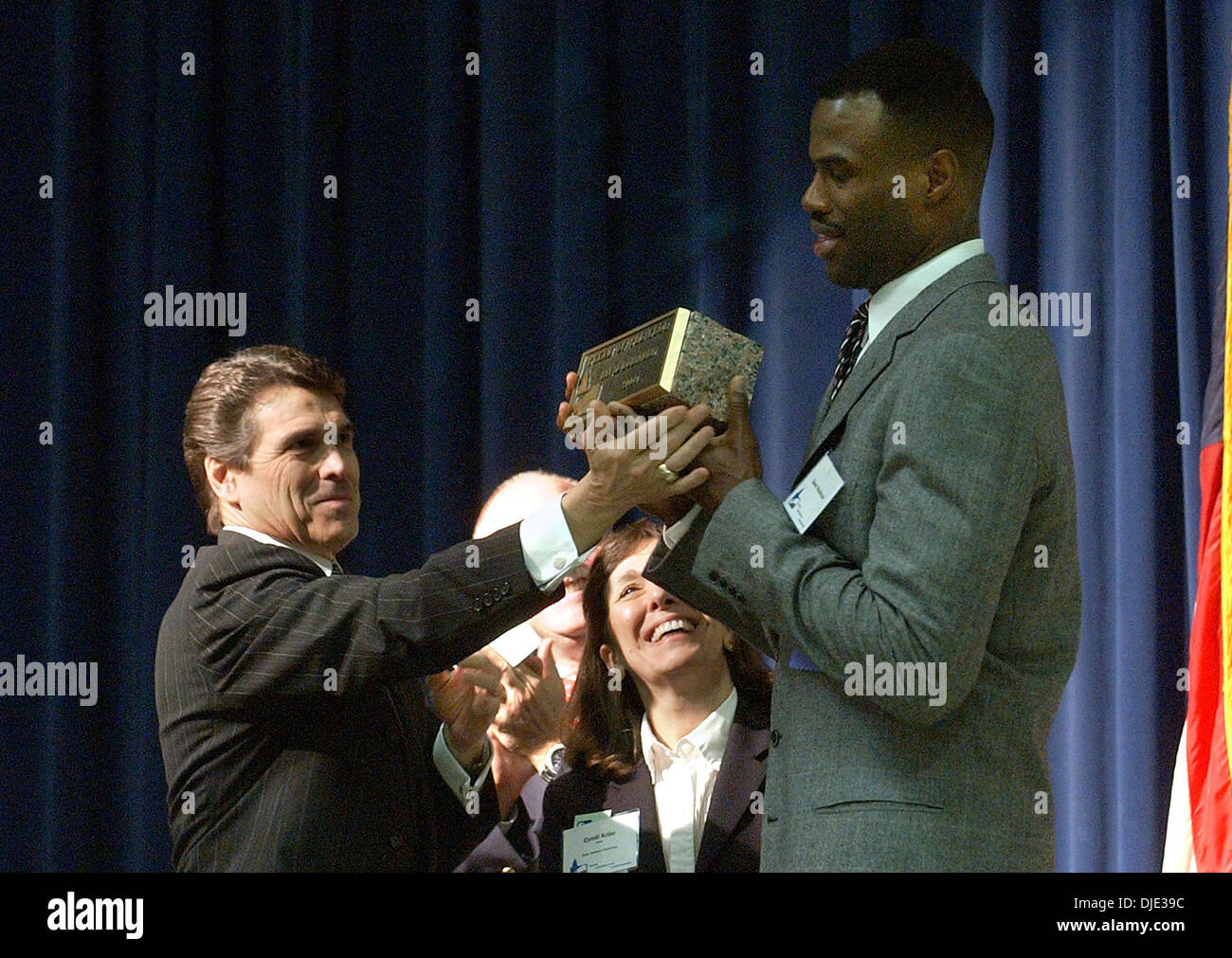 Mar 26, 2004; San Antonio, TX, USA; Former San Antonio Spurs player DAVID ROBINSON, who is the main benefactor of the Carver Academy, right, receives the Texan of the Year award from Gov. Rick Perry in New Braunfels on Friday, March 26, 2004. Stock Photo