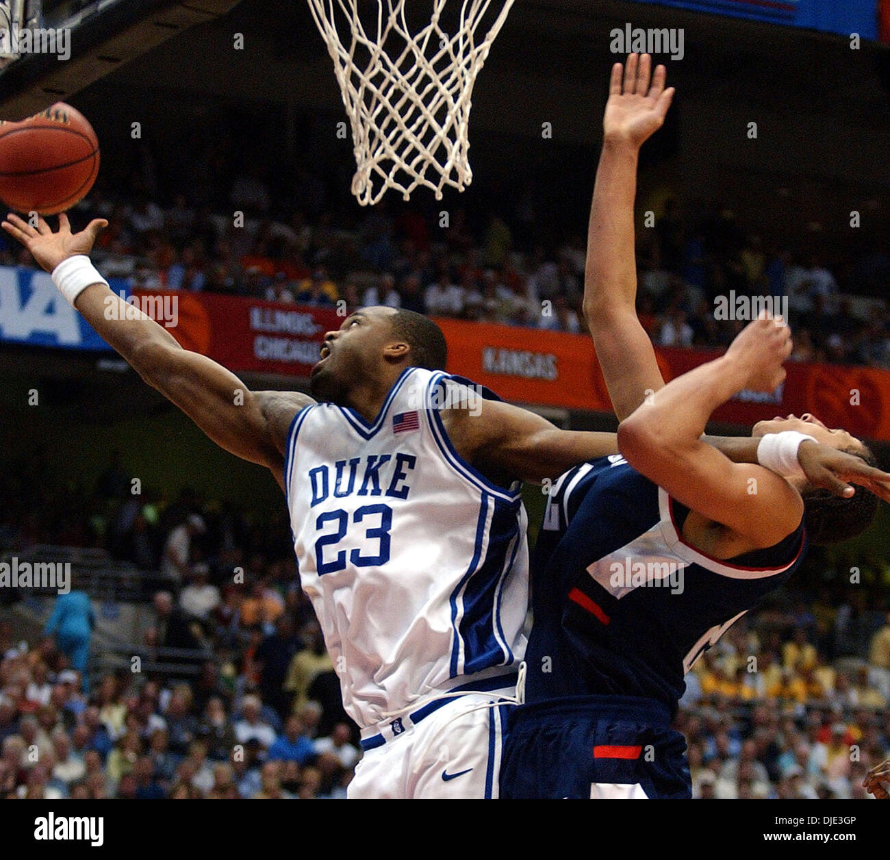 Apr 03, 2004; San Antonio, TX, USA; Duke SHELDON WILLIAMS(23) against UCONN'S JOSH BOONE for the rebound during second half action NCAA Final Four semi-final match at the Alamodome Saturday, April 3, 2004. Stock Photo