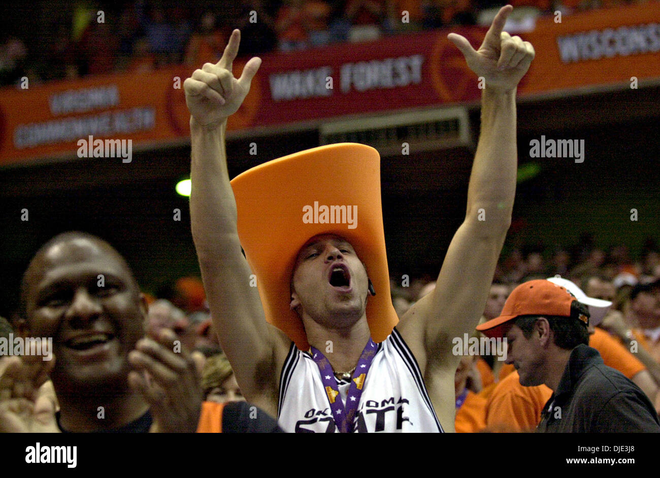 Apr 03, 2004; San Antonio, TX, USA; OSU fan BRIAN BOBIK, 23, cheers during the first quarter of the Oklahoma State and Georgia Tech Final Four game Saturday, April 3, 2004 at the Alamodome. His brother Daniel Bobik is a guard for the Cowboys. Stock Photo
