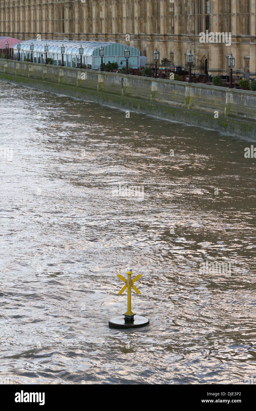 Security buoy on the river Thames by the houses of parliament, London, UK Stock Photo