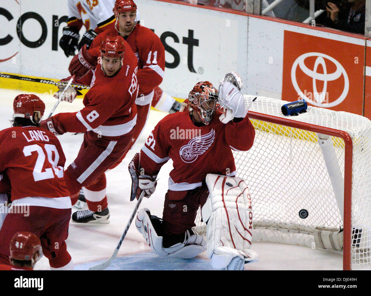 Apr 22, 2004; Detroit, MI, USA; CURTIS JOSEPH watches the overtime game-winning goal hit the back of the net, along with ROBERT LANG, JIRI FISCHER and MATHIEU DANDENAULT as the Wings drop game one 2-1 during the Western Conference semi-finals game between the Detroit Red Wings and Calgary Flames at Joe Louis Arena. Stock Photo