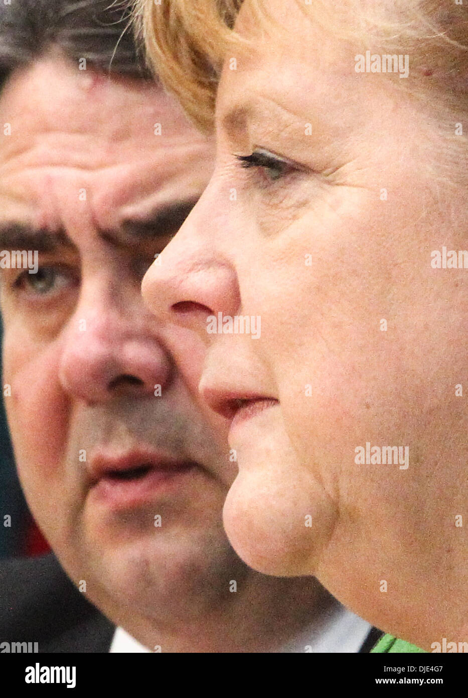 Berlin, Germany. 27th Nov, 2013. Sigmar Gabriel (L), Chairman of the Social Democratic Party (SPD) and German Chancellor Angela Merkel attend a press conference in Berlin, Germany, on Nov. 27, 2013. Leaders from Germany's main parties signed provisionally a coalition agreement on Wednesday, paving the road for forming a new government two months after a federal election. Credit:  Zhang Fan/Xinhua/Alamy Live News Stock Photo