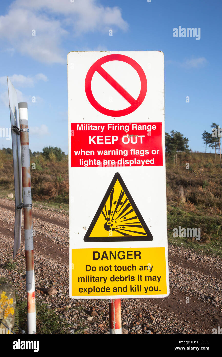 Warning signs on a military firing range at Ash Ranges, Surrey - danger of unexploded bombs and ordnance Stock Photo