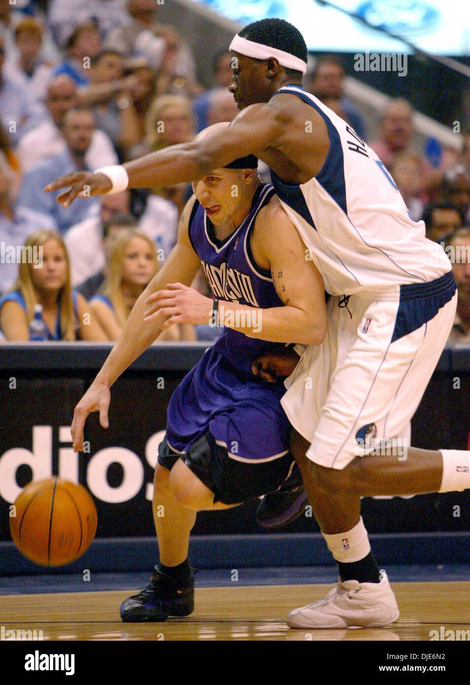 Apr 26, 2004; Dallas, TX, USA; MIKE BIBBY dribbles past a Mavericks player during the first round playoff game in Dallas. With this matchup of the league's two highest-scoring teams looking more and more like an slugfest, Stojakovic provided a rare burst of offense over the last five minutes of the third quarter. The Kings started it down by two and finished it up by five. They nev Stock Photo