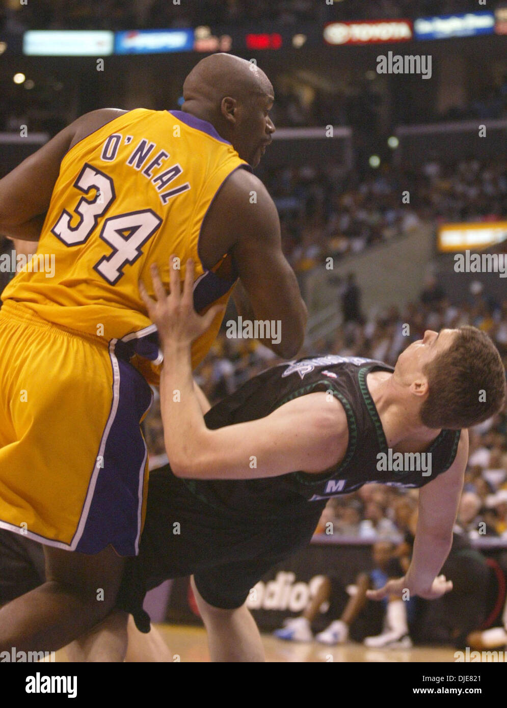 May 27, 2004; Los Angeles, CA, USA; SHAQUILLE O'NEAL fouls MARK MADSEN (35) during the second