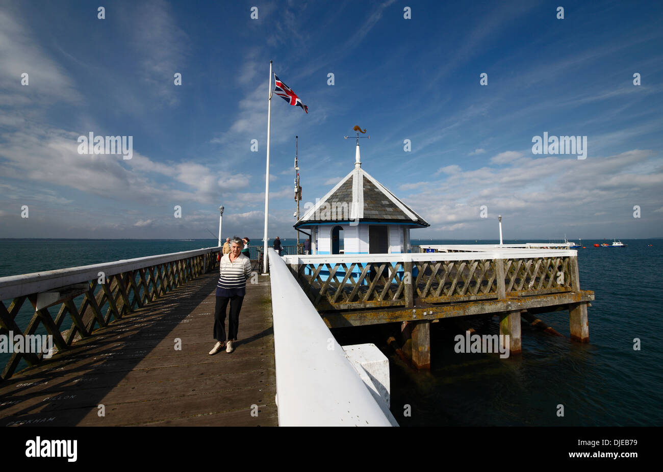 People on Yarmouth pier Yarmouth Isle of Wight Hampshire England Stock Photo