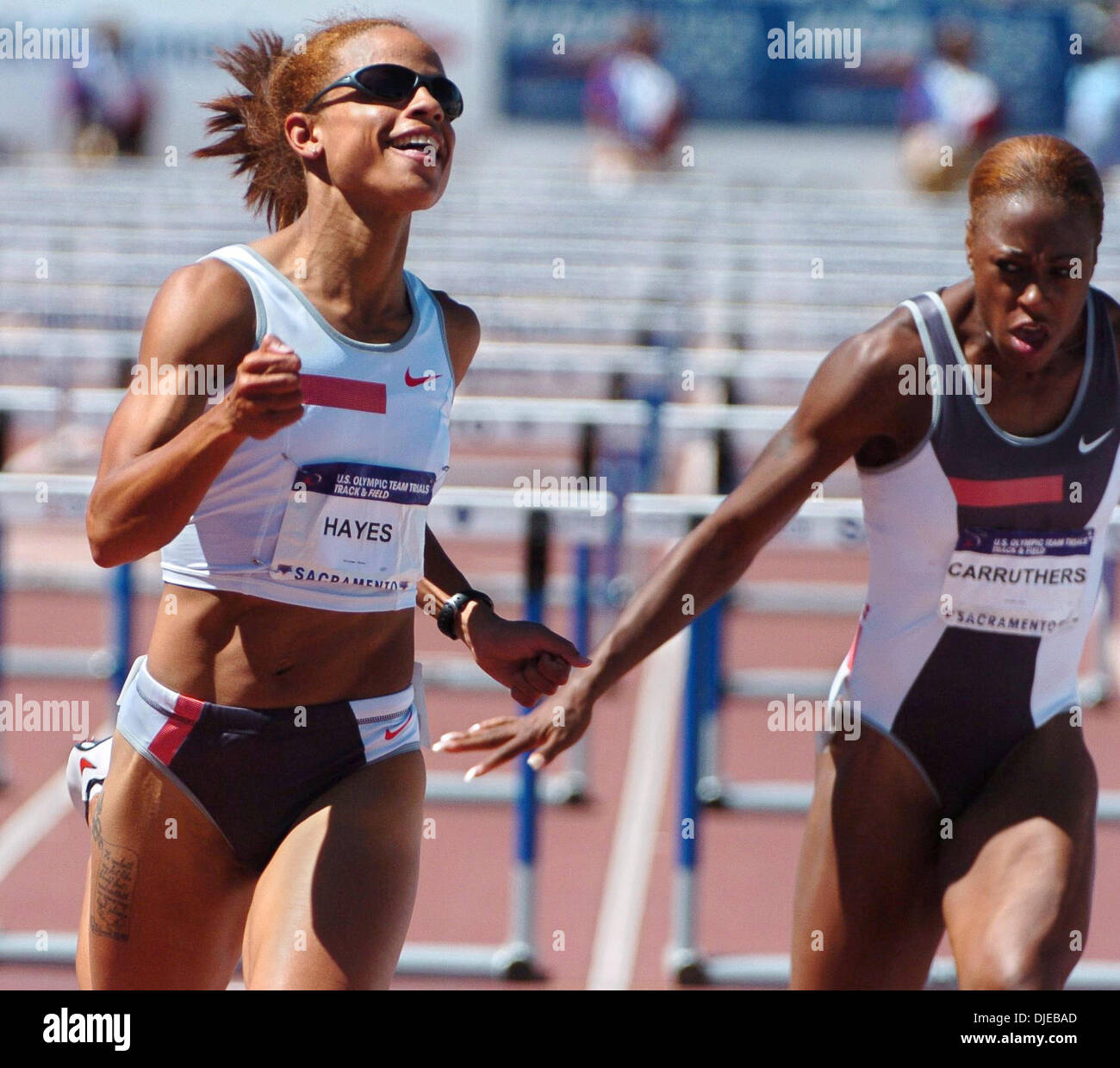Jul 18, 2004; Sacramento, CA, USA; JOANNA HAYES (L) reacts to her first