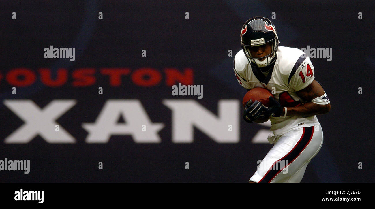 HOUP2002090801 - Houston, Sept. 8, (UPI) -- Houston Texans quarterback  David Carr (8) tries to escape the Dallas Cowboys defense during the 2nd  quarter on Sept. 8, 2002, in Houston. The Texans