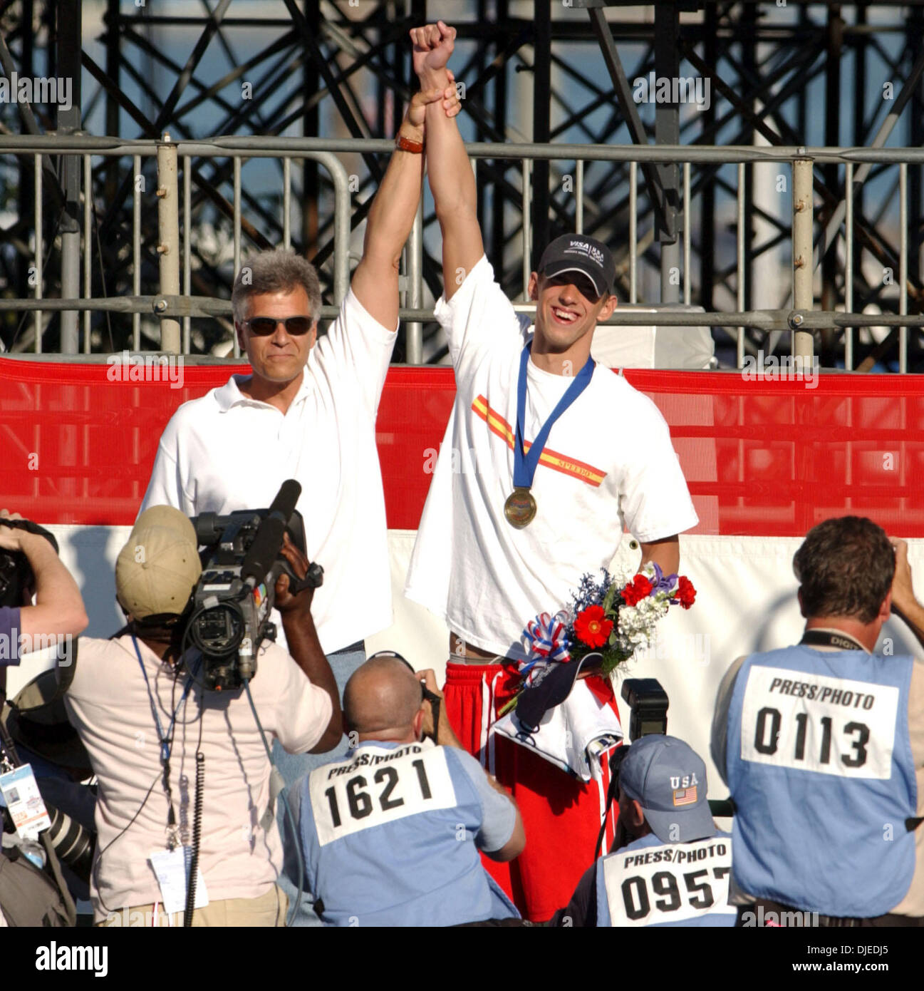 7-time Gold Medal champion Mark Spitz met Michael Phelps for the first time Saturday July 10, 2004 at the U.S. Olympic Team Swim Trials in Long Beach, Calif and presented the rising swim star with his 1st place medal for the 200m Butterfly. (Contra Costa Times/Karl Mondon )/ZUMA Press Stock Photo