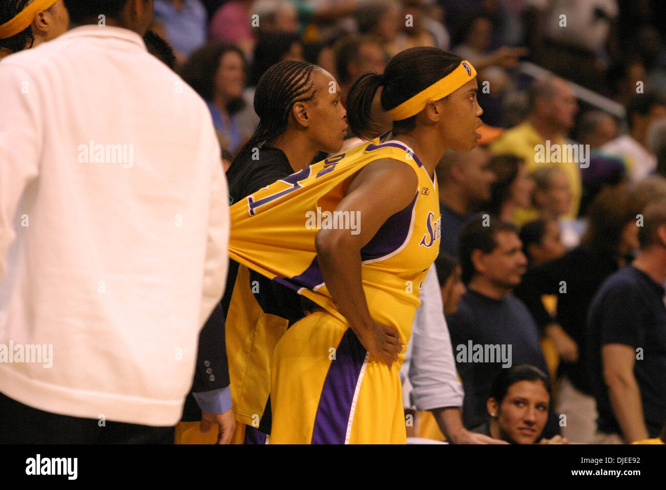 Sep 03, 2004; Los Angeles, CA, USA; In an incredibly physical game the Los Angeles Sparks edged out Seattle Storm 82-81 at the Staples center. Picture shows: Teammates hold back Los Angeles Sparks player TAMECKA DIXON after she is escorted off the court after being ejected from the game for getting involved in an altercation with Seattle Storm player Betty Lennox. Stock Photo