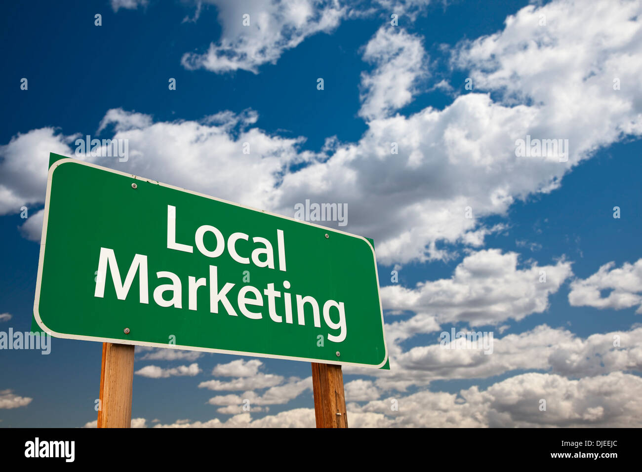 Local Marketing Green Road Sign with Dramatic Sky and Clouds Stock ...