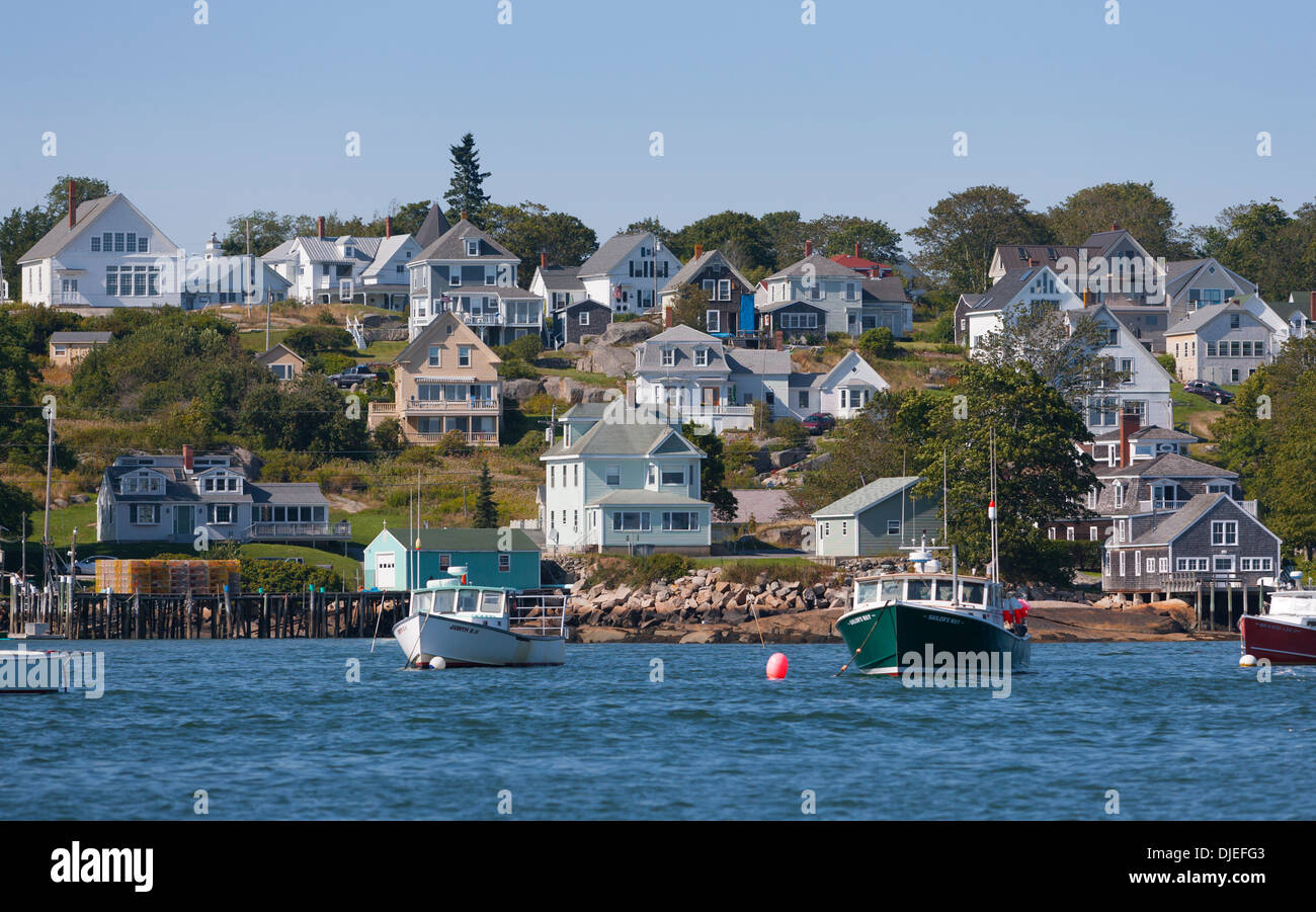 Lobster boats moored in front of the houses of the town of Stonington, ME. Stock Photo