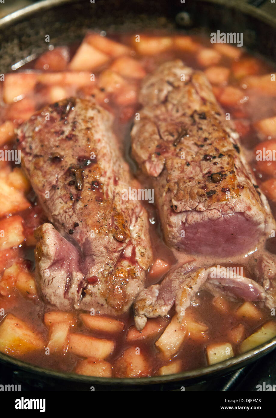 Cooking Pork in Apples and Sauces Stock Photo Alamy