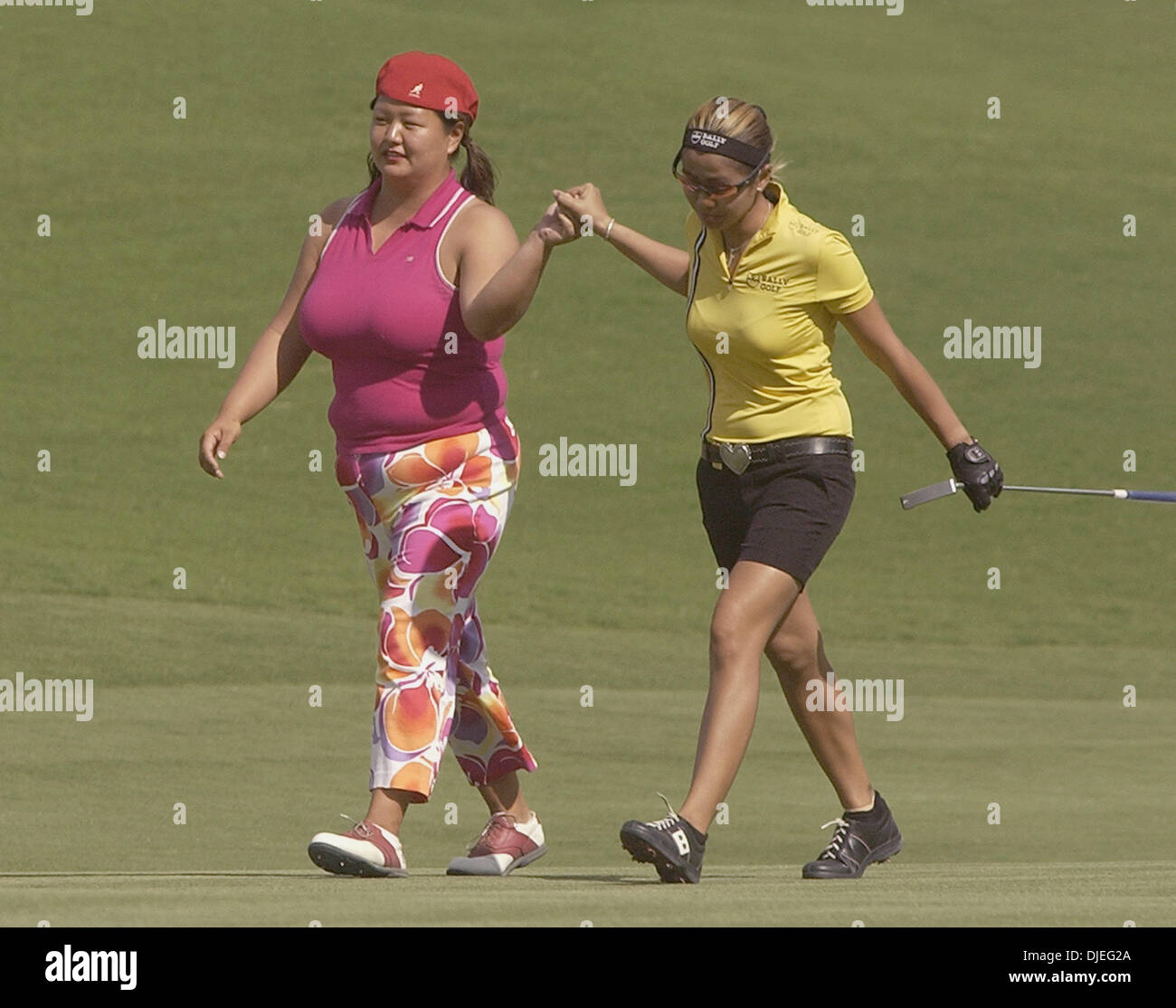 Oct 17 2004 Palm Desert Ca Usa Lpga Pros Christina Kim L And Jennifer Rosales Walk Hand In Hand Up The Fairway During The Samsung World Championship Stock Photo Alamy