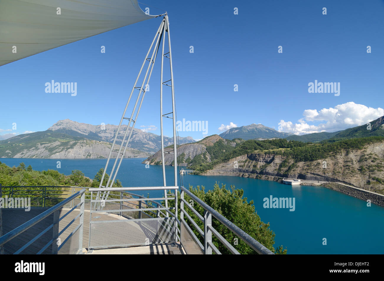 Viewing Platform Looking over the Lac de Serre-Ponçon or Serre Poncon Lake or Reservoir Barrage & Dam Hautes-Alpes or Hautes Alps France Stock Photo