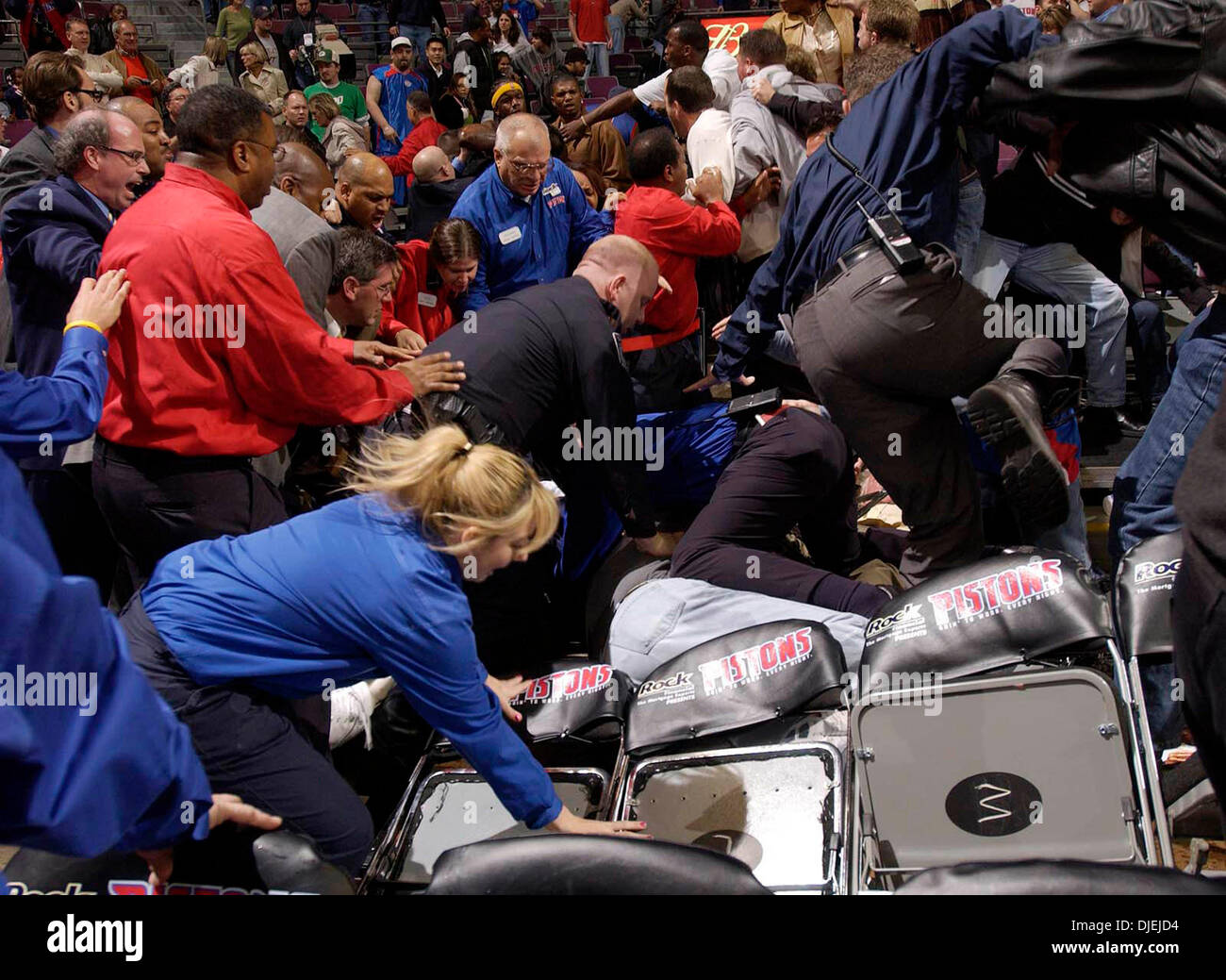 Nov 19, 2004; Auburn Hills, MI, USA; Palace Security rush into the stands to separate Pacers players and fans duringr a brawl near the end of the Detroit Pistons vs Indiana Pacers game in Auburn Hills, Michigan. Stock Photo
