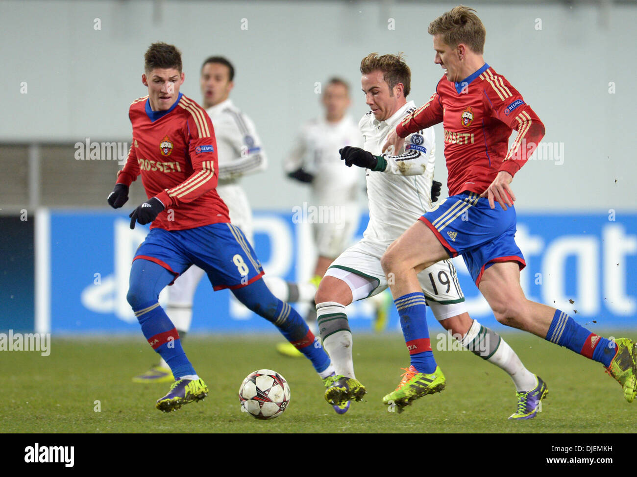 Moscow, Russia. 27th Nov, 2013. Moscow's Steven Zuber (L) and Pontus Wernbloom (R) fight for the ball with Munich's Mario Goetze during the UEFA Champions League Group D soccer match between CSKA Moscow and FC Bayern Munich at Arena Chimki in Moscow, Russia, 27 November 2013. Photo: Andreas Gebert/dpa/Alamy Live News Stock Photo