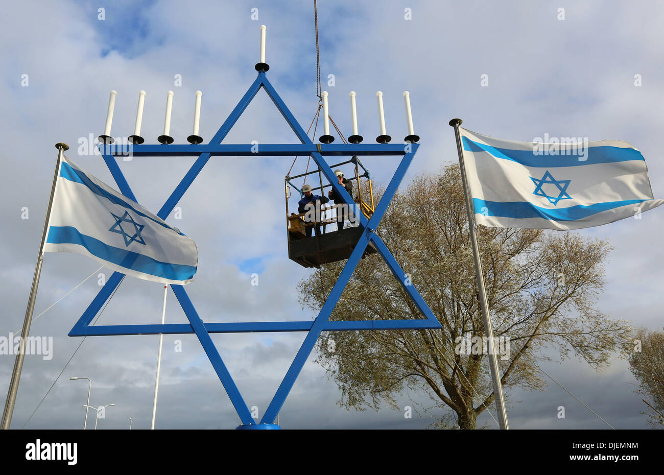 The largest chanoekia (menorah) of the world is since 25-11-2013 situated next to the building of the organization 'Christians for Israel' in the Dutch city Nijkerk. The nine-branched candelabrum in the form of the Star of David, is almost 12 meters high. The first candle will ligted up Wednesday 27-11-2013 at the start of the Jewish festival of lights, Hanukkah (commemoration of the dedication of the temple in the year 164 BC). The nine-branched candelabrum refers to the menorah in the Temple in Jerusalem, which miraculously kept burning for eight days on the oil for just one day. Foto: VidiP Stock Photo