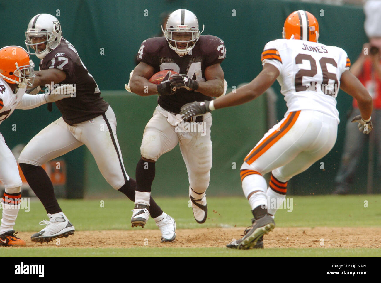 Oakland Raiders LaMont Jordan moves through a big hole as Cleveland