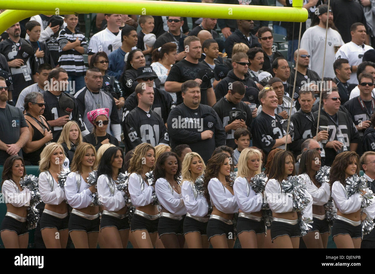 Sep 23, 2007 - OAKLAND, CA, USA - Oakland Raiderettes and fans stand during the National Anthem before a game against the Cleveland Browns at McAfee Coliseum. (Credit Image: © Al Golub/ZUMApress.com) Stock Photo