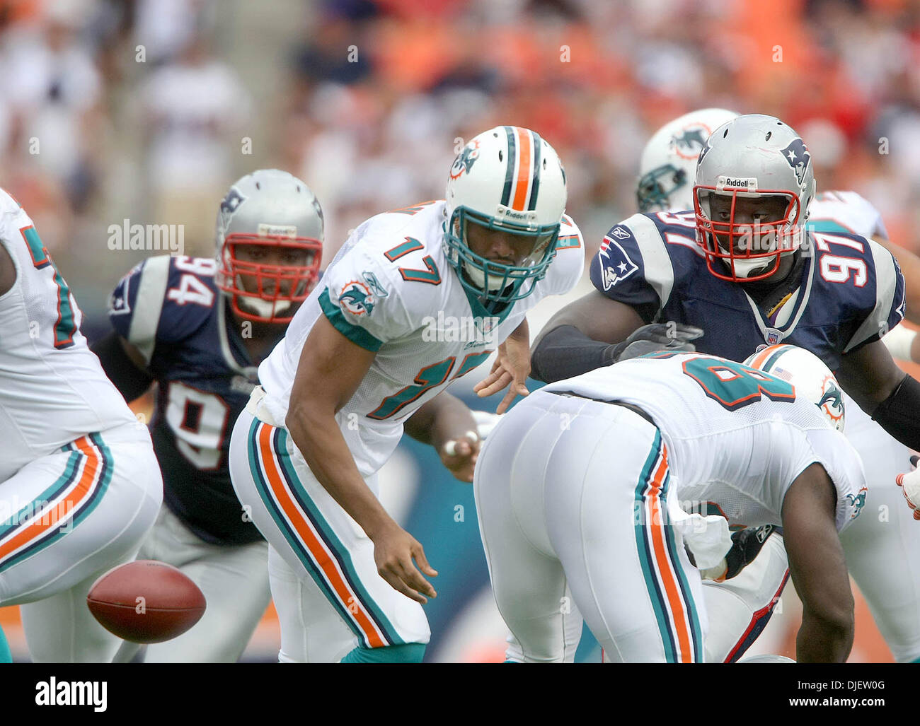 Miami Dolphins quarterback Cleo Lemon (17) fumbles the football in the  first quarter as New England Patriots linebacker Rosevelt Colvin (59) looks  on during a football game at Dolphin Stadium in Miami
