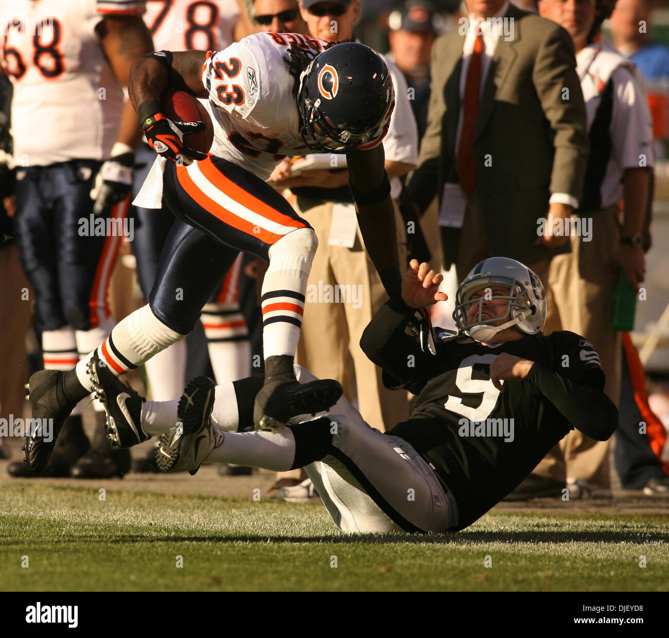 November 11th, 2007 - Oakland, California, USA - Oakland Raiders punter Shane Lechler drags Chicago Bears punt returner Devin Hester (23) out of bounds in the third quarter of their NFL football game, Sunday, Nov. 11, 2007 at McAfee Coliseum in Oakland, Calif.  The Bears won, 17-6.  (Credit Image: © D. Ross Cameron/The Oakland Tribune/ZUMA Press) Stock Photo