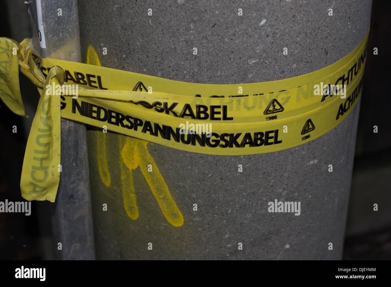 Yellow Tape Warning Achtung Niederspannungskabel Germany Stock Photo