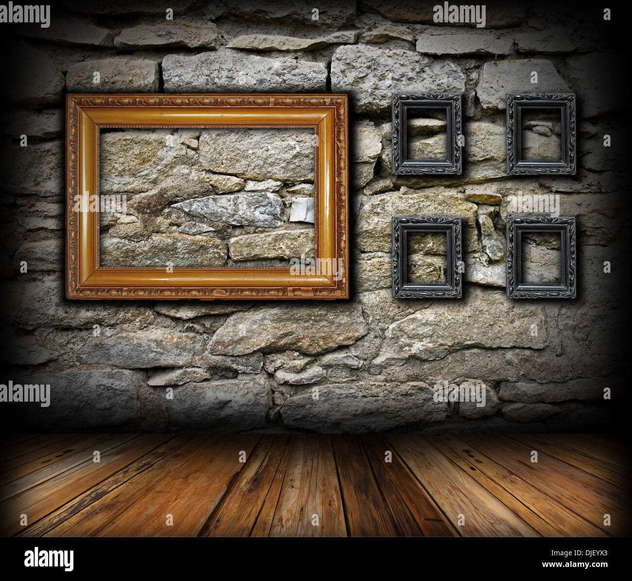 vintage interior backdrop with wooden frames on grunge stone wall Stock Photo