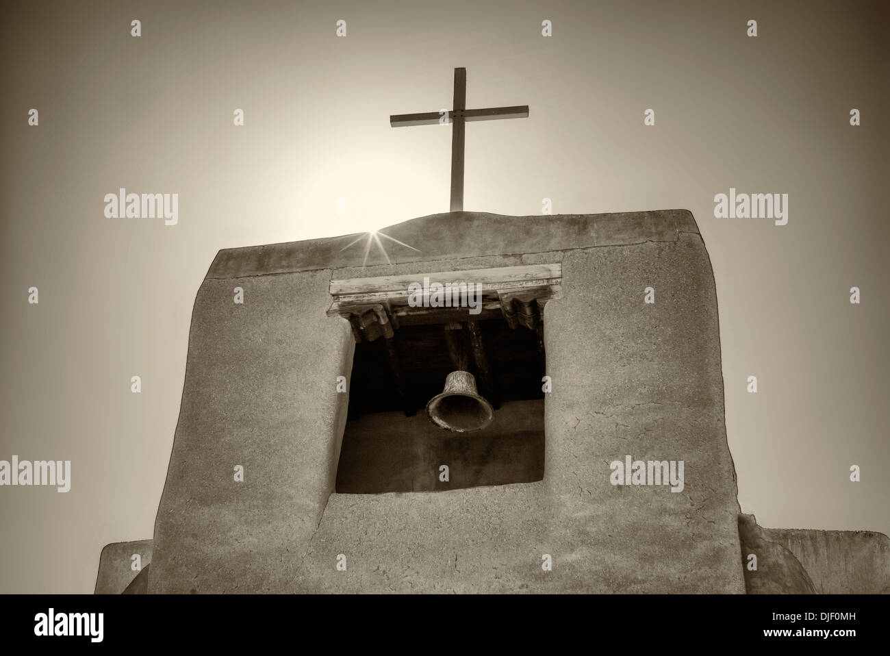 Cross and church bell. San Miguel Mission. Santa Fe, New Mexico. Stock Photo