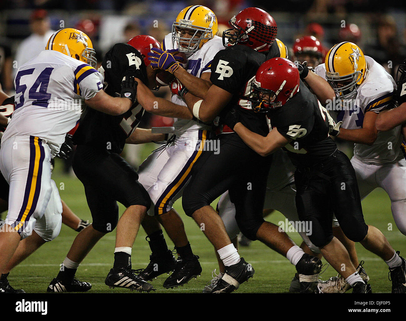 Nov 23, 2007 - Minneapolis, Minnesota, USA - Cretin-Derham Hall's SHADY SALAMON was tackled by three Eden Prairie defenders in the second half. Eden Prairie won the game 50-21 victory to capture the Class 5A Championship at the 2007 Minnesota State High School State Football Tournament at the Metrodome Friday, November 23.  (Credit Image: © Jim Gehrz/Minneapolis Star Tribune/ZUMA P Stock Photo