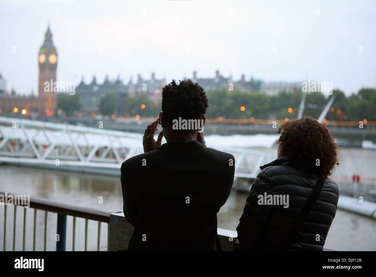 Tourists photographing London attractions. Stock Photo