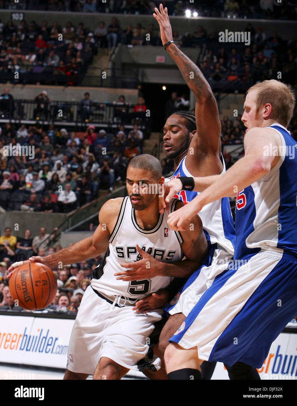 Dec 22, 2007 - San Antonio, Texas, USA - Spurs' IME UDOKA drives around Clippers' JOSH POWELL and CHRIS KAMAN during second half action Saturday Dec. 22, 2007 at the AT&T Center. The Spurs won 99-90.  (Credit Image: © Edward A. Ornelas/San Antonio Express-News/ZUMA Press) RESTRICTIONS: * San Antonio, Seattle Newspapers and USA Tabloids Rights OUT * Stock Photo