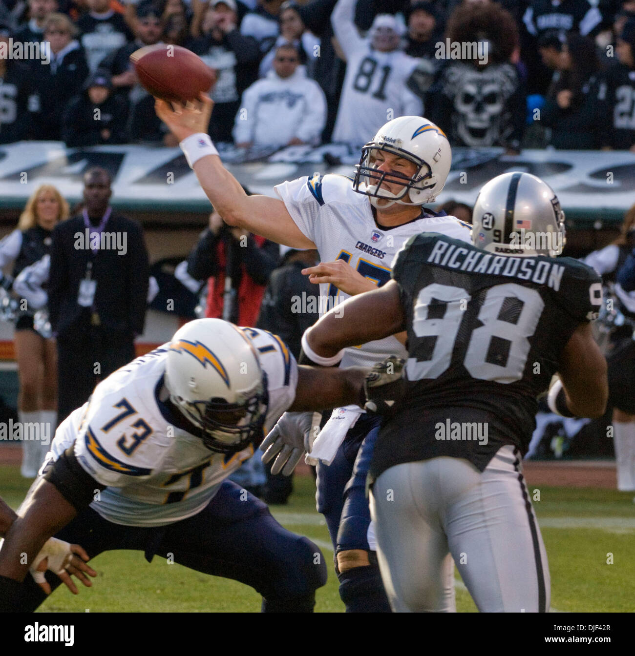 Dec 30, 2007 - OAKLAND, CA, USA - San Diego Chargers quarterback PHILIP RIVERS #17 throws a pass while offensive tackle MARCUS MCNEILL #73 blocks Oakland Raiders defensive end JAY RICHARDSON #98 during their game at McAfee Coliseum. (Credit Image: © Al Golub/ZUMApress.com) Stock Photo