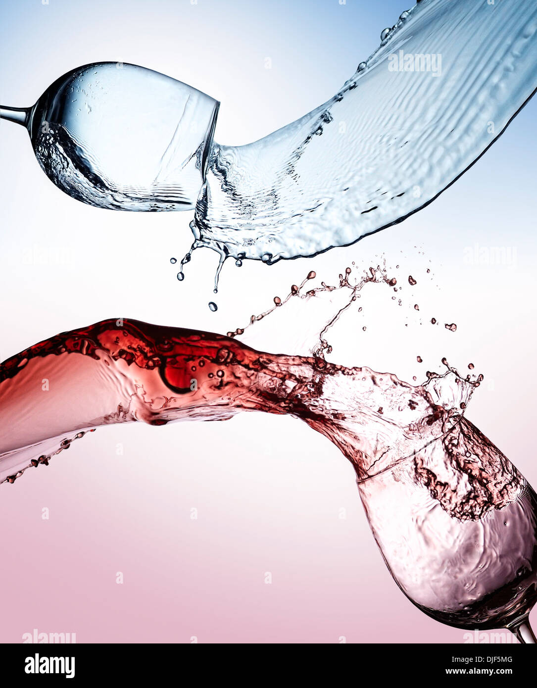 Splashes of glasses of water and wine Stock Photo
