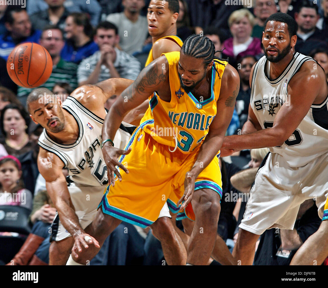 Jan 26, 2008 - SAN ANTONIO, Texas, USA - San Antonio Spurs versus New Orleans Hornets at the At&T Center. PICTURED:   Hornets center MELVIN ELY loses control uinder pressure from Spurs guard IME UDOKA  in the first half . (Credit Image: © TOM REEL/San Antonio Express-News/ZUMA Press) RESTRICTIONS: * San Antonio, Seattle Newspapers and USA Tabloids Rights OUT * Stock Photo