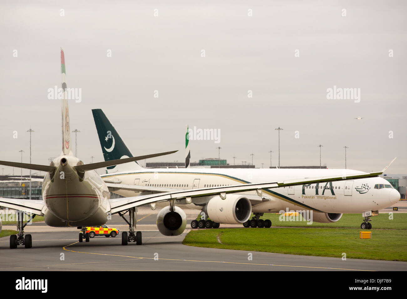 Planes taxiing towards arrivals at Manchester Airport, UK. Stock Photo