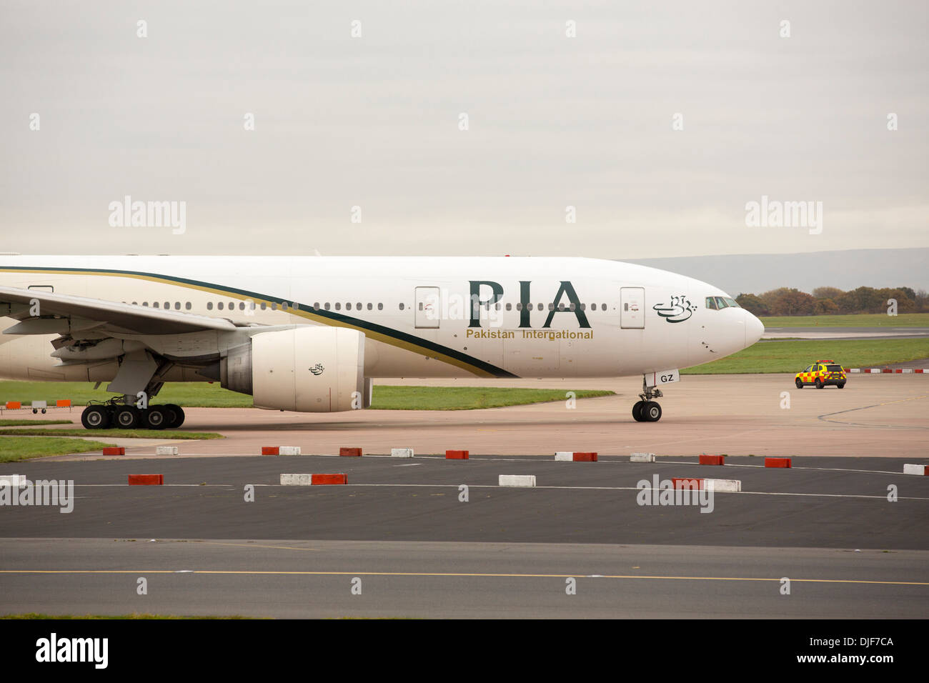A Pakistan airlienes plane taxiing towards the runway at Manchester Airport, UK. Stock Photo