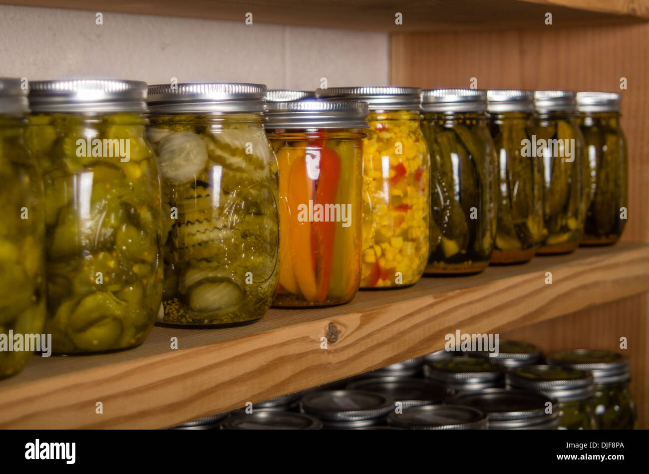 Canned goods on wooden storage shelves in pantry Stock Photo Alamy