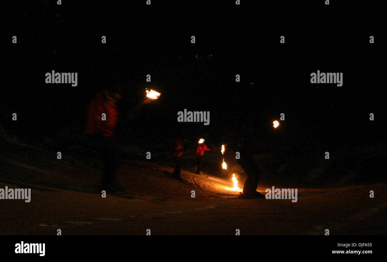 Feb 20, 2008 - Gulmarg, Kashmir, India - Competitors practice on the snow showing their performance carrying lighted torches on the evening of the 2nd day of the National Winter Games in Gulmarg, 55km (34 miles) west of Srinagar, February 20, 2008. Participants from various Indian states are competing in winter sports in the fifth edition of the Games. (Credit Image: © Altaf Zargar Stock Photo