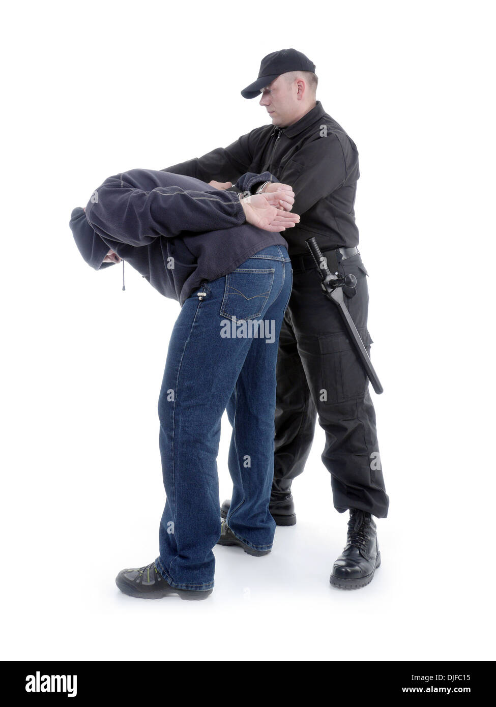 Handcuffed man being escorted by the policeman Stock Photo