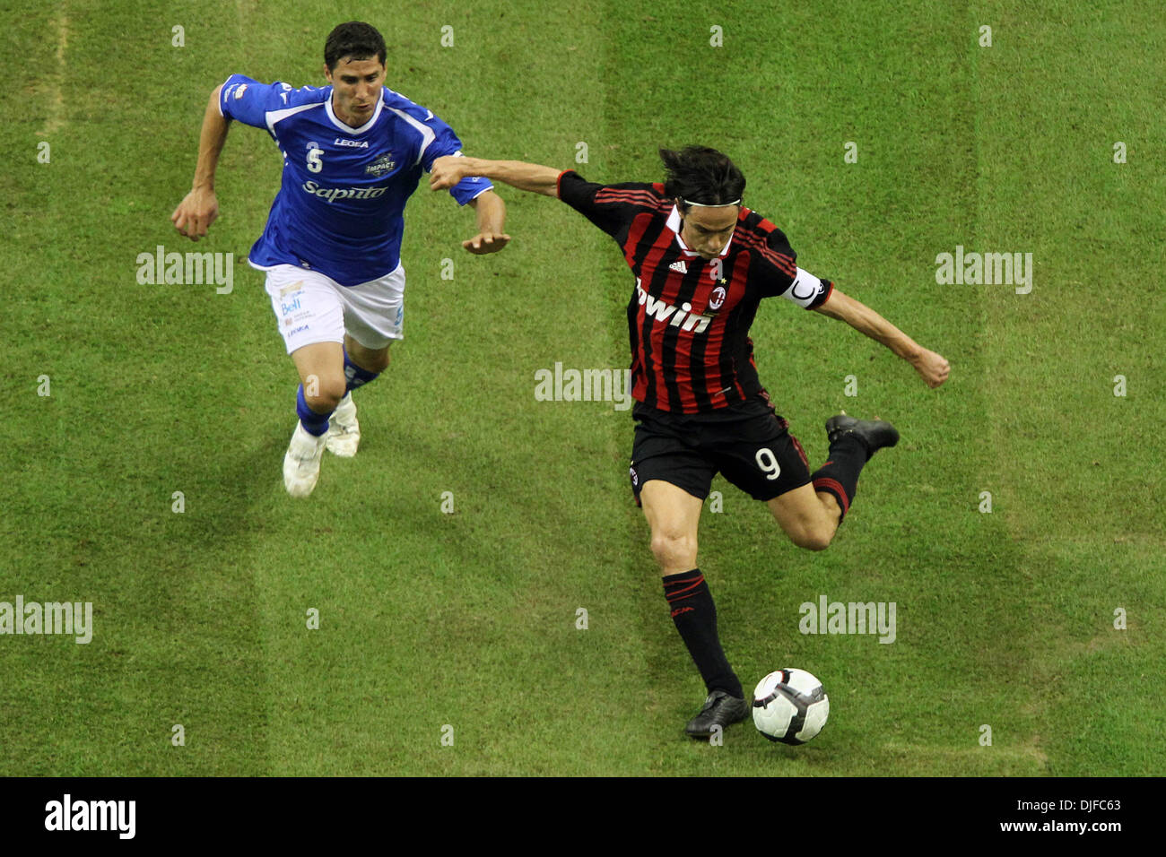 June 03, 2010 - Montreal, Quebec, Canada - 2 June 2010:  Montreal Impact's defender Nevio Pizzolitto (#5) battle for the ball with AC Milan's forward Filippo Inzaghi (#9) in game action during the first half of play of the friendly FIFA exhibition game between AC Milan and the Montreal Imapct played at the Olympic Stadium in Montreal, Canada. AC Milan won 4-1..Mandatory Credit: Phi Stock Photo