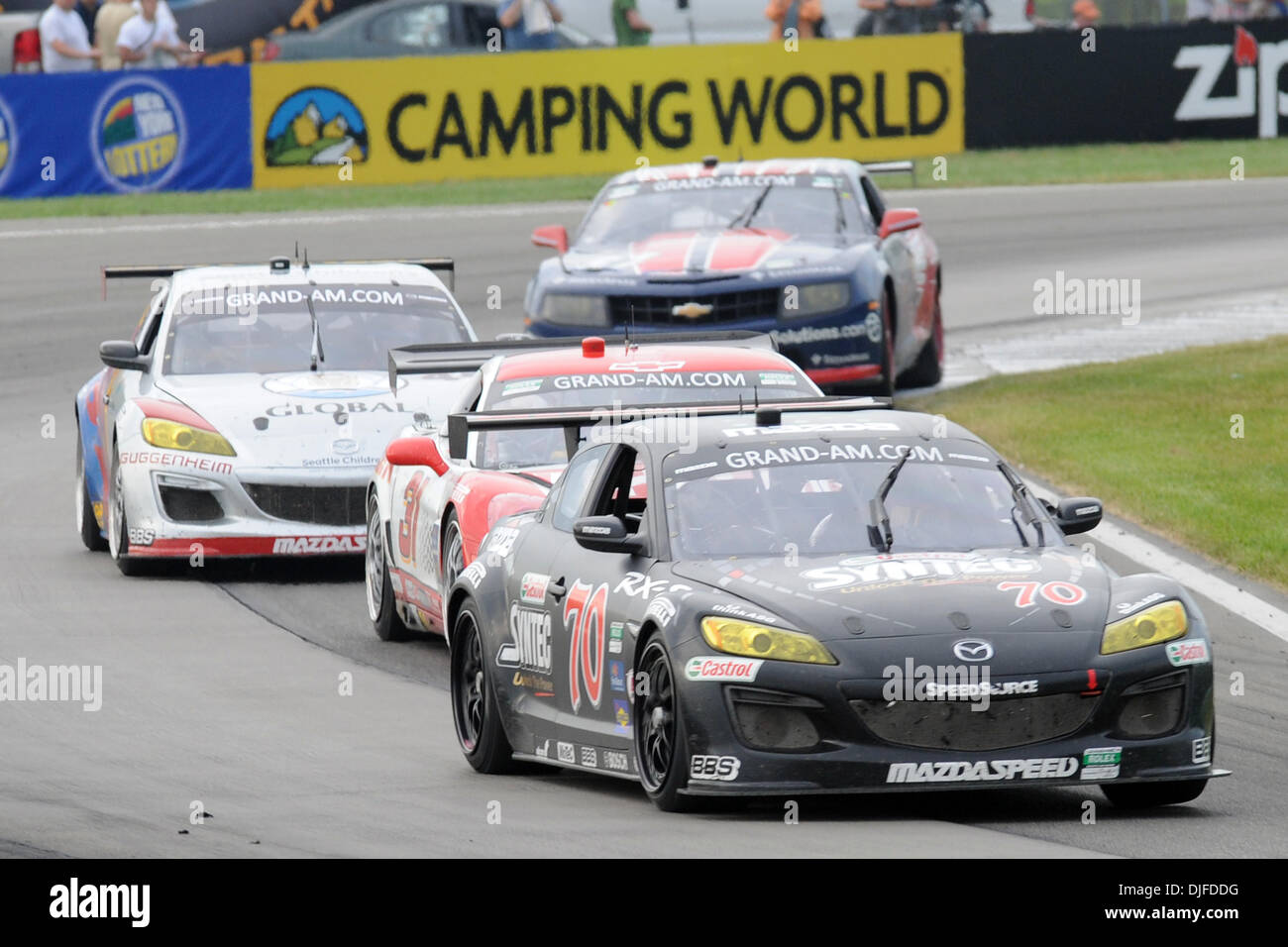 The 70 Mazda RX8 form SpeedSource leads the GT Class cars from Marsh