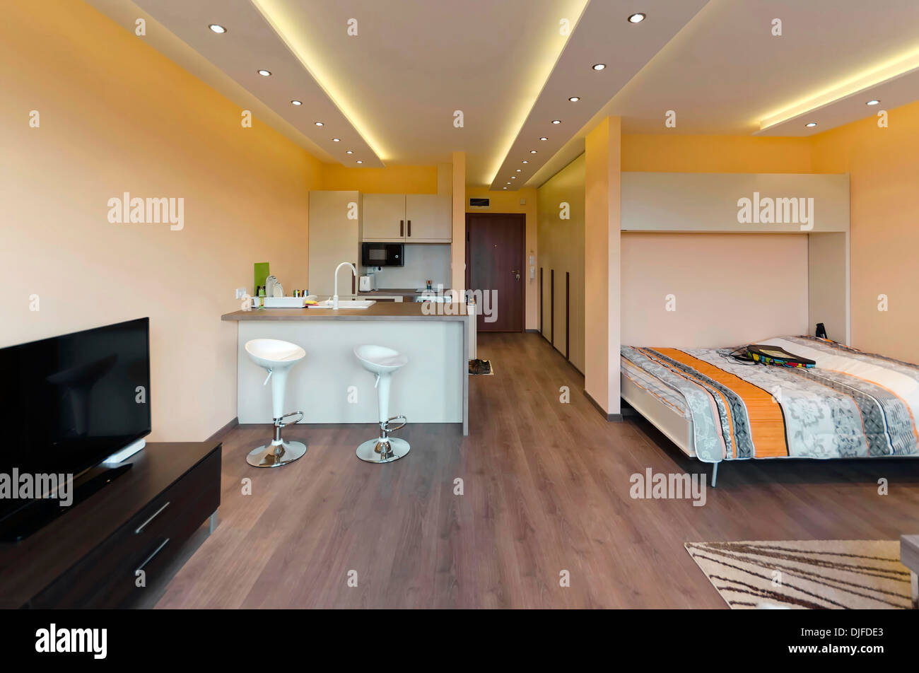 Modern living room with kitchen corner Stock Photo