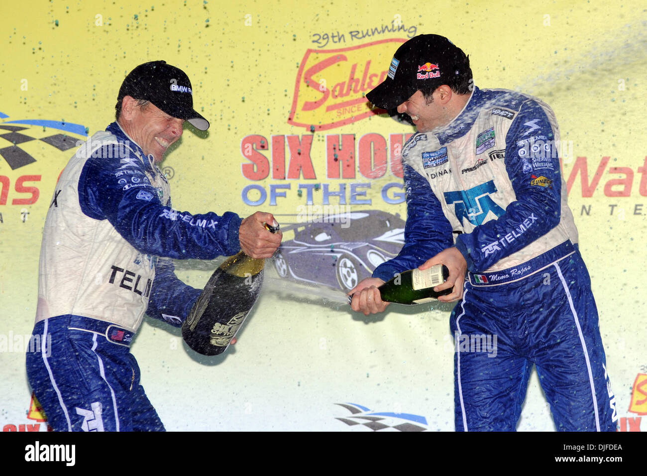 Race winners Scott Pruett (left) and Memo Rojas celebrate in victory lane by spraying champagne at each other after winning the Sahlen's Six Hours of the Glen at Watkins Glen, New York. (Credit Image: © Michael Johnson/Southcreek Global/ZUMApress.com) Stock Photo