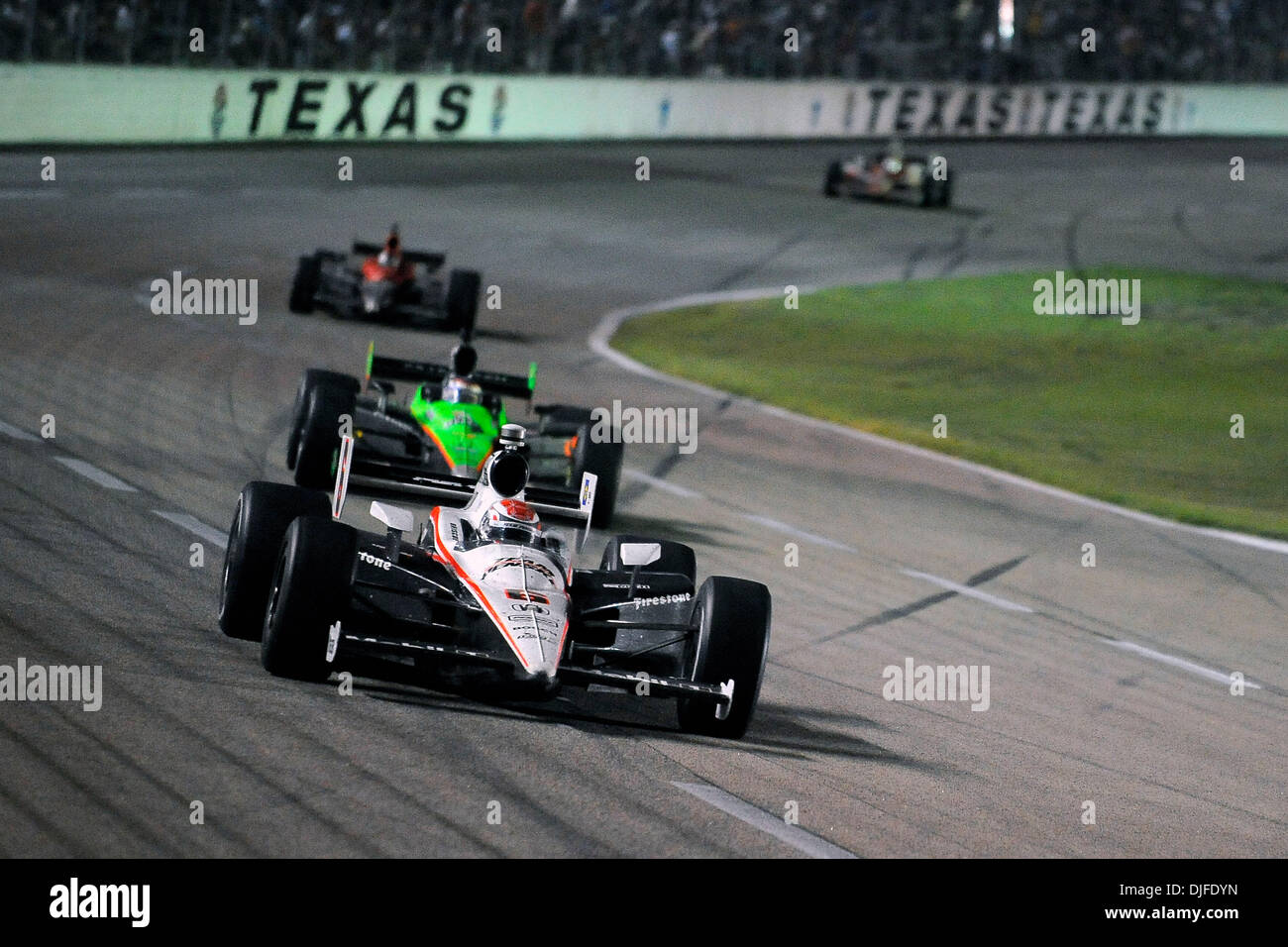 Australian driver Ryan Briscoe (6) holds off the competition during the