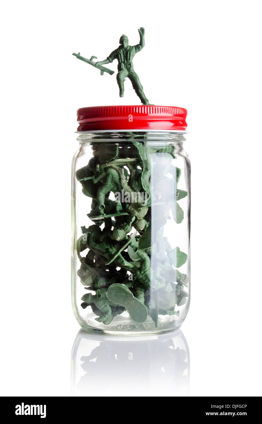 Toy soldiers placed in a jar Stock Photo