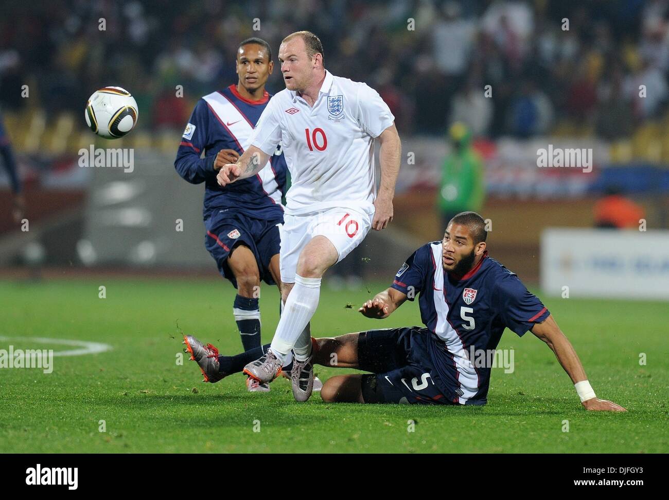 Jun 12, 2010 - Rustenburg, South Africa - WAYNE ROONEY of England fights for the ball with OGUCHI ONYEWU of USA during the FIFA World Cup 2010 football match between England and USA at the Royal Bafokeng Stadium. (Credit Image: Â© Luca Ghidoni/ZUMApress.com) Stock Photo