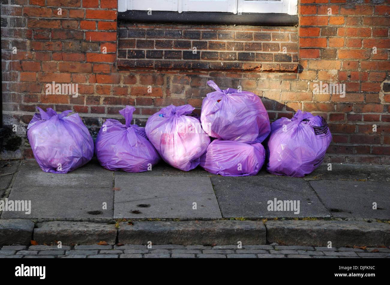 https://c8.alamy.com/comp/DJFKNC/rubbish-bags-left-on-pavement-DJFKNC.jpg