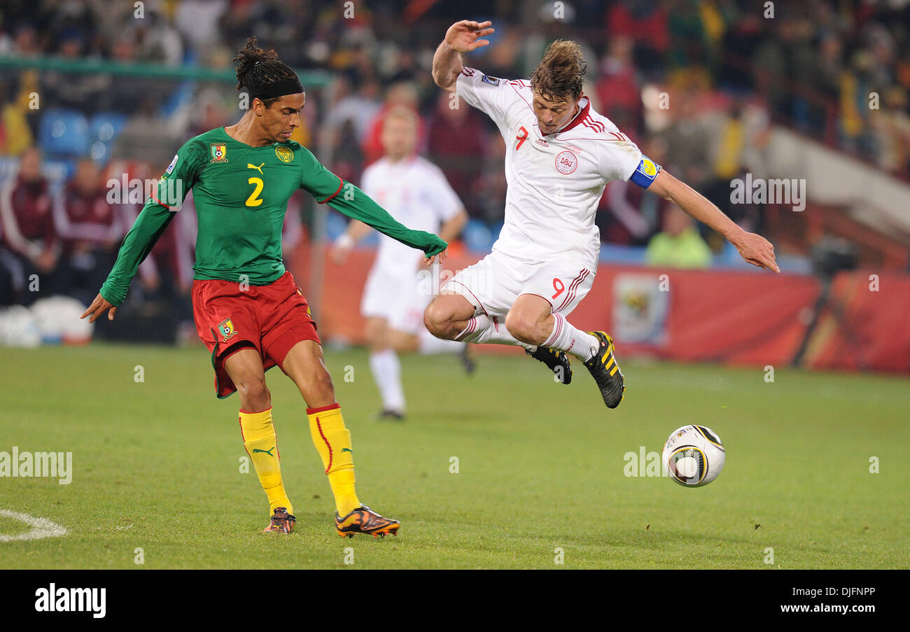 June 19, 2010 - Pretoria, South Africa - Benoit Assou-Ekotto of Cameroon fights for the ball with Jon Dahl Tomasson of Denmark during the FIFA World Cup 2010 soccer match between Cameroon and Denmark at Loftus Versfeld Stadium on June 18, 2010 in Pretoria, South Africa. (Credit Image: © Luca Ghidoni/ZUMApress.com) Stock Photo