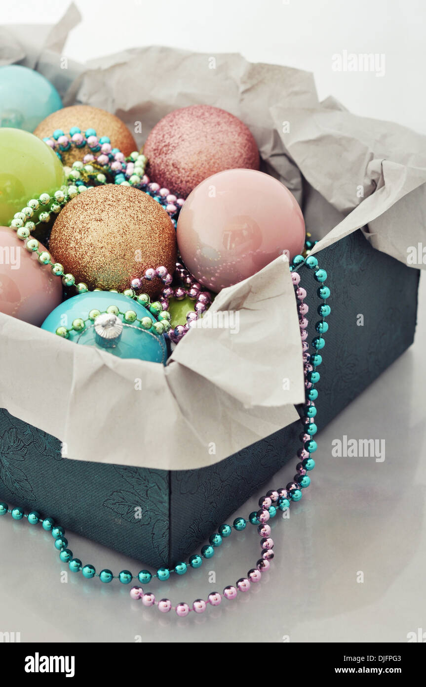 Box with christmas decorations on light background closeup Stock Photo